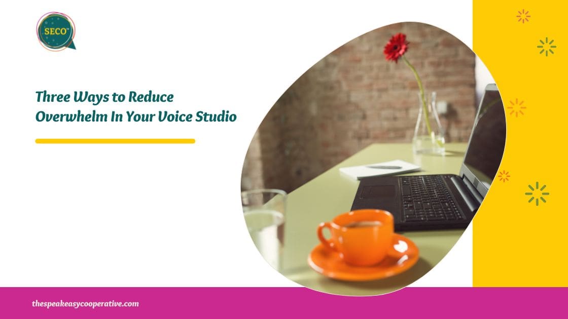 Relaxing with a cup of coffee and a red flower in a vase at the computer desk. This represents the blog title, "Three Ways to Reduce Overwhelm In Your Voice Studio."